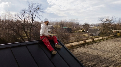 contractor sitting on roof during cold weather