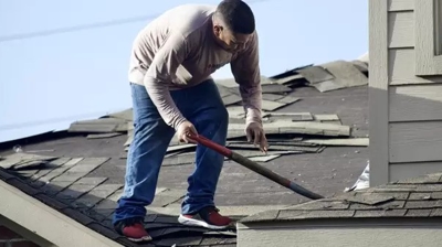 man working on a roof