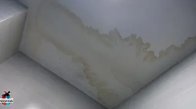 Watermark on kitchen ceiling signaling a potential roof emergency