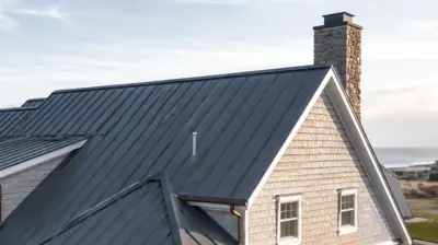 Standing seam metal roof on a coastal home in Narragansett Rhode Island near the ocean.