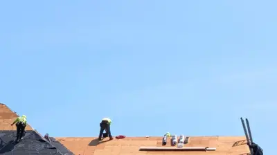 New CDX plywood roof decking installed during a roof replacement on an older home in Lincoln, RI before new asphalt shingles are installed.