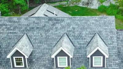 Luxury Rhode Island home with Brava synthetic slate roof and premium copper detailing.