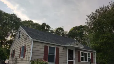 Newly completed architectural shingle roof replacement in Warwick, Rhode Island after an insurance claim.