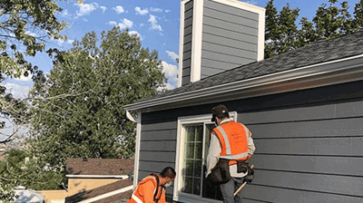 Experienced roofer performing roof maintenance