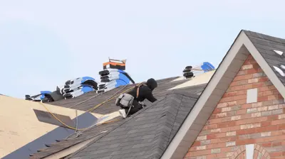 roof replacement contractor installing new shingles