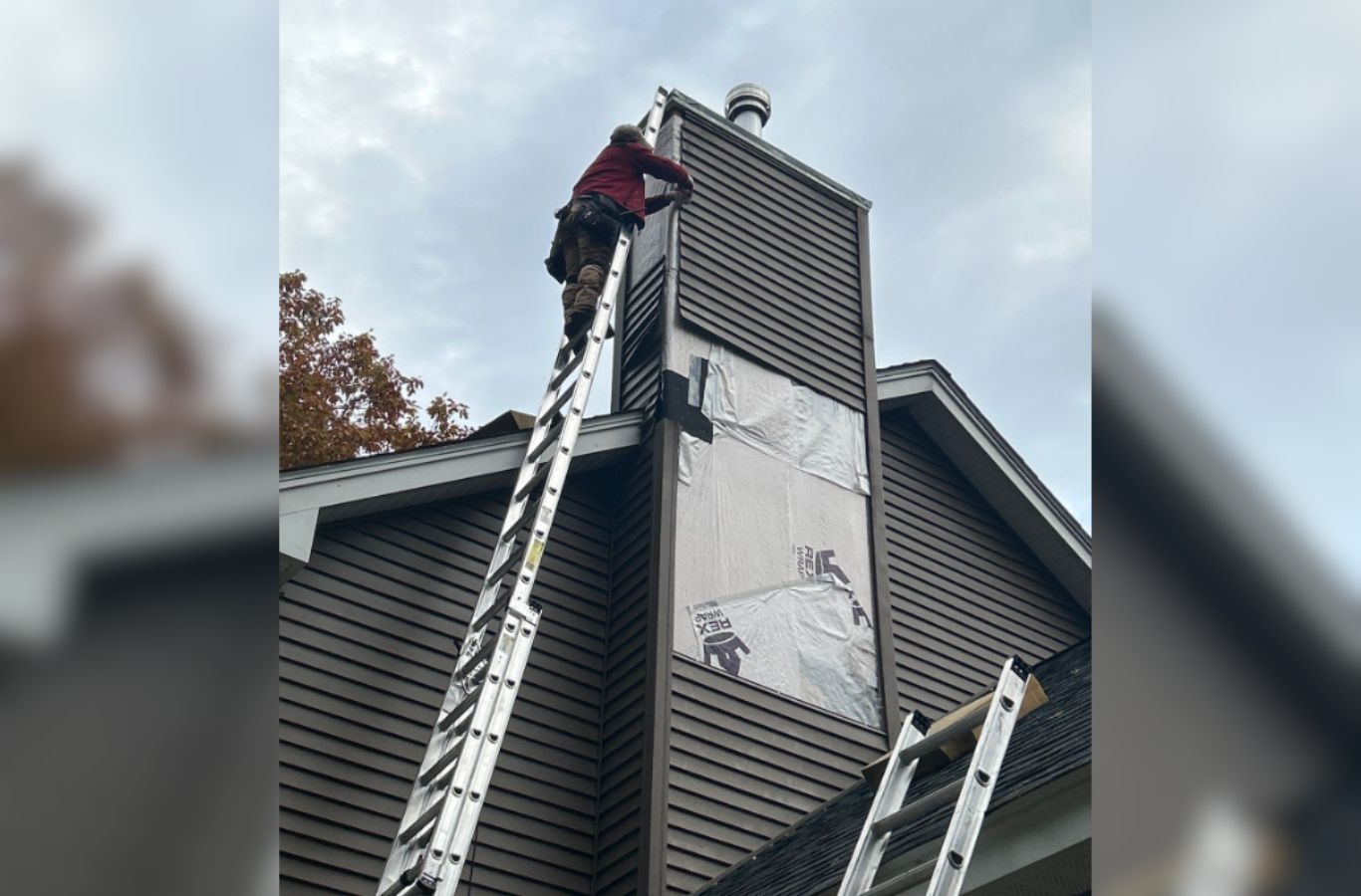 A Mighty Dog Roofing of Greater Middlesex County expert applying premium siding in Chelmsford, MA, showcasing clean lines and expert craftsmanship. Siding Company near me.