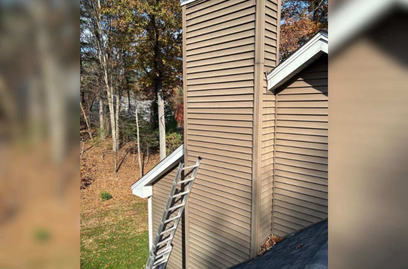A siding technician from Mighty Dog Roofing completing trim detail in Methuen, MA with care, precision, and high-quality craftsmanship. Siding Company near me.