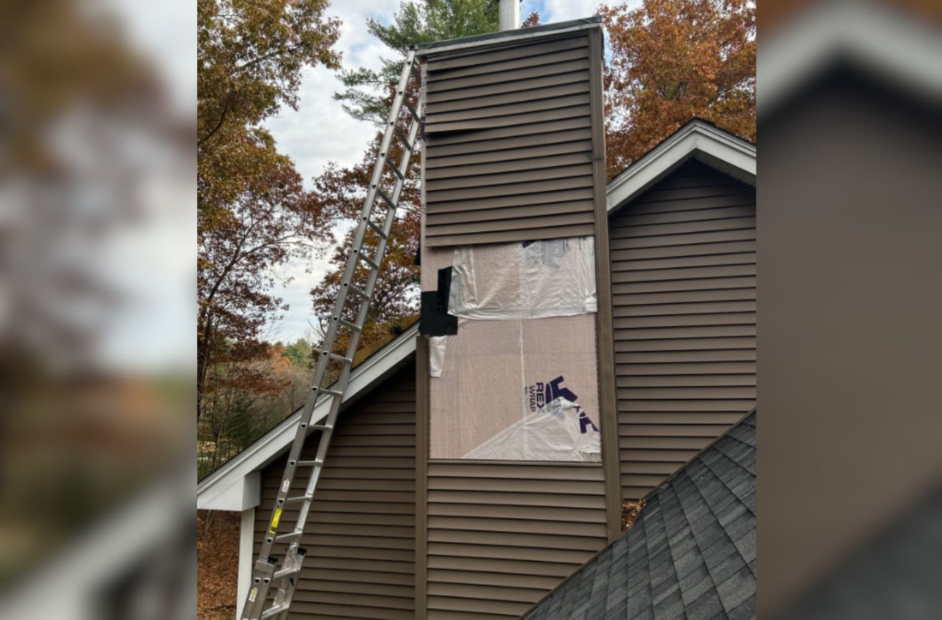 A siding specialist from Mighty Dog Roofing finishing a home exterior in Woburn, MA with careful attention to detail and lasting quality. Siding Company near me.