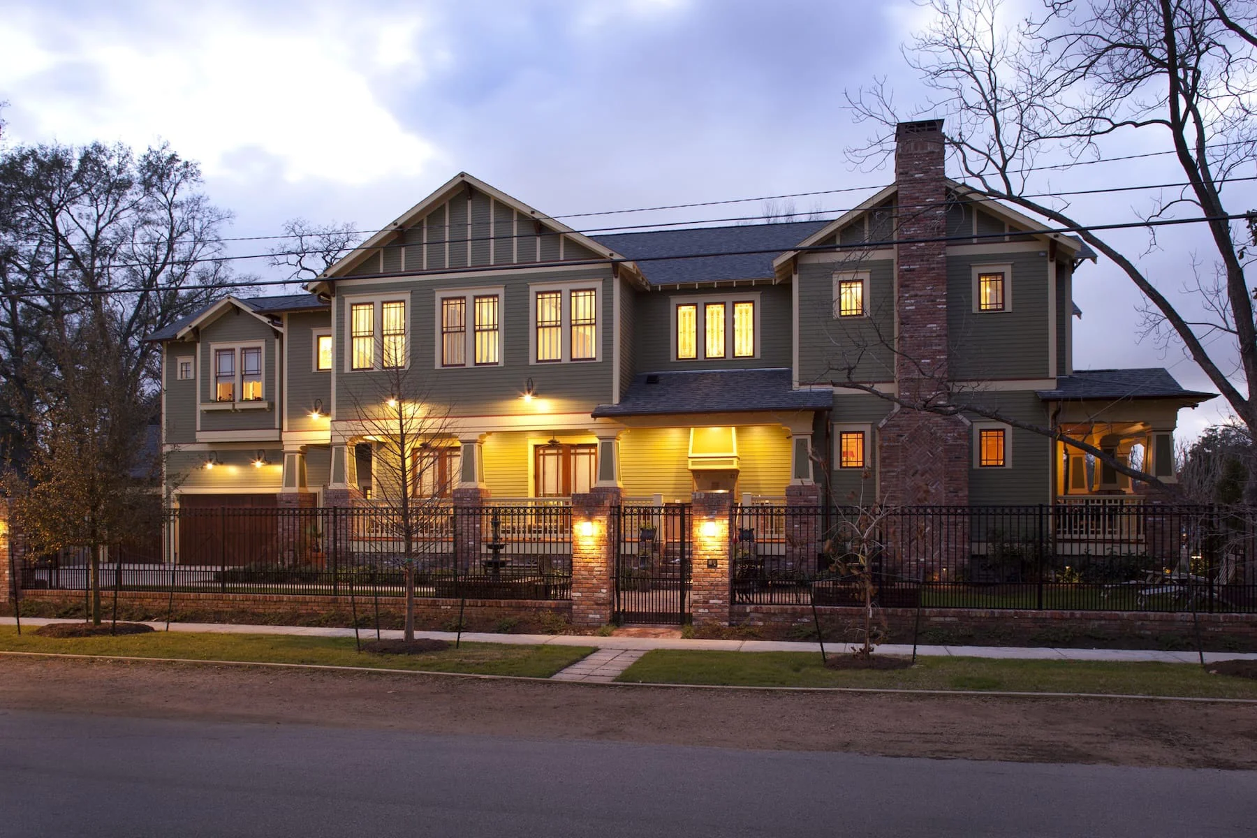 a house at dusk with sage siding