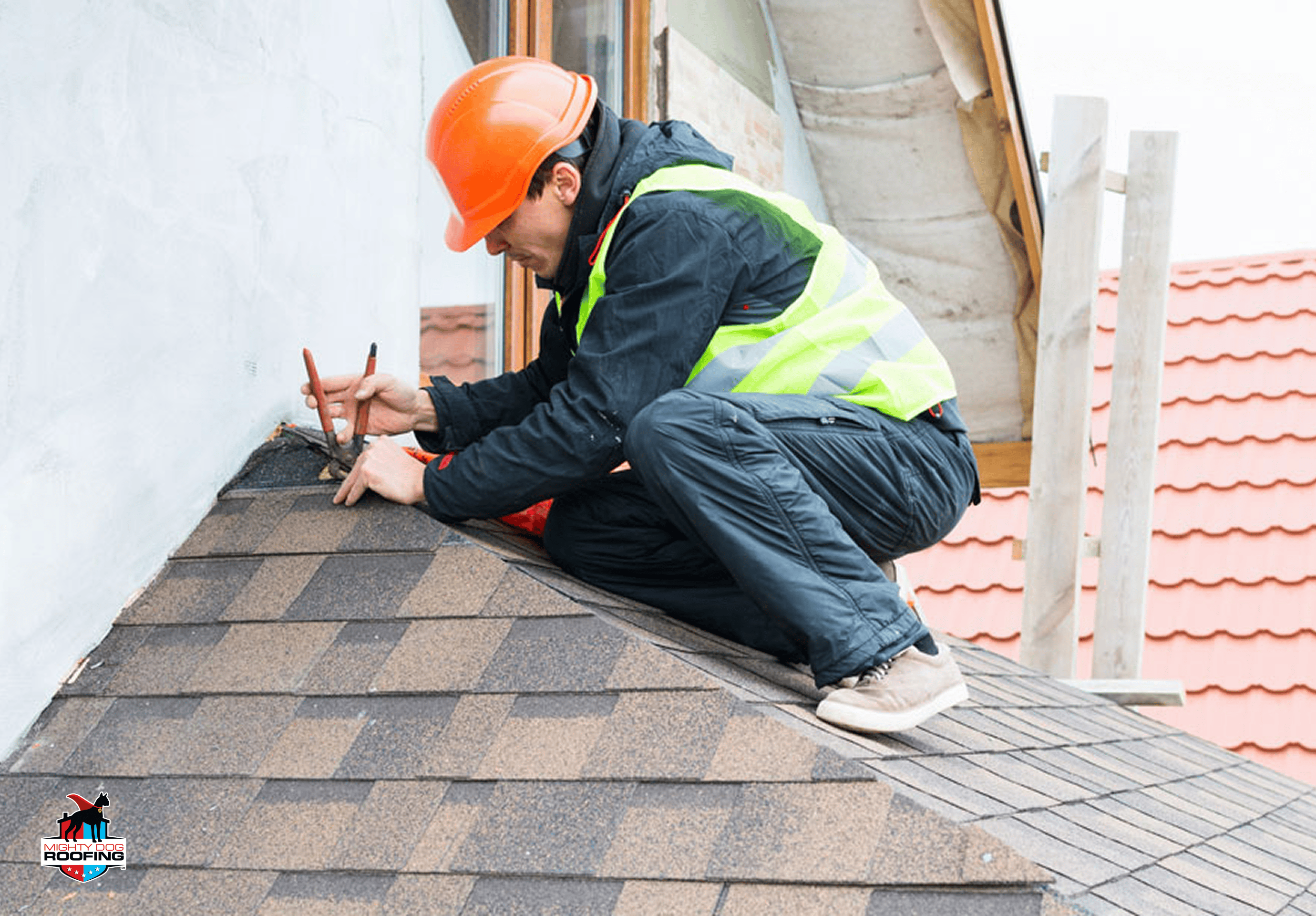Roofing contractor inspecting and preparing roof
