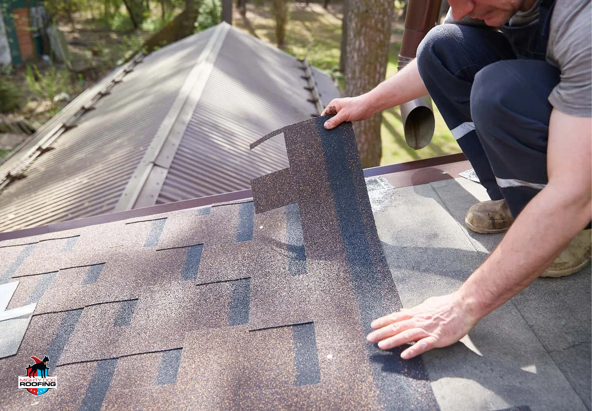 Roofing contractor installing architectural asphalt shingles
