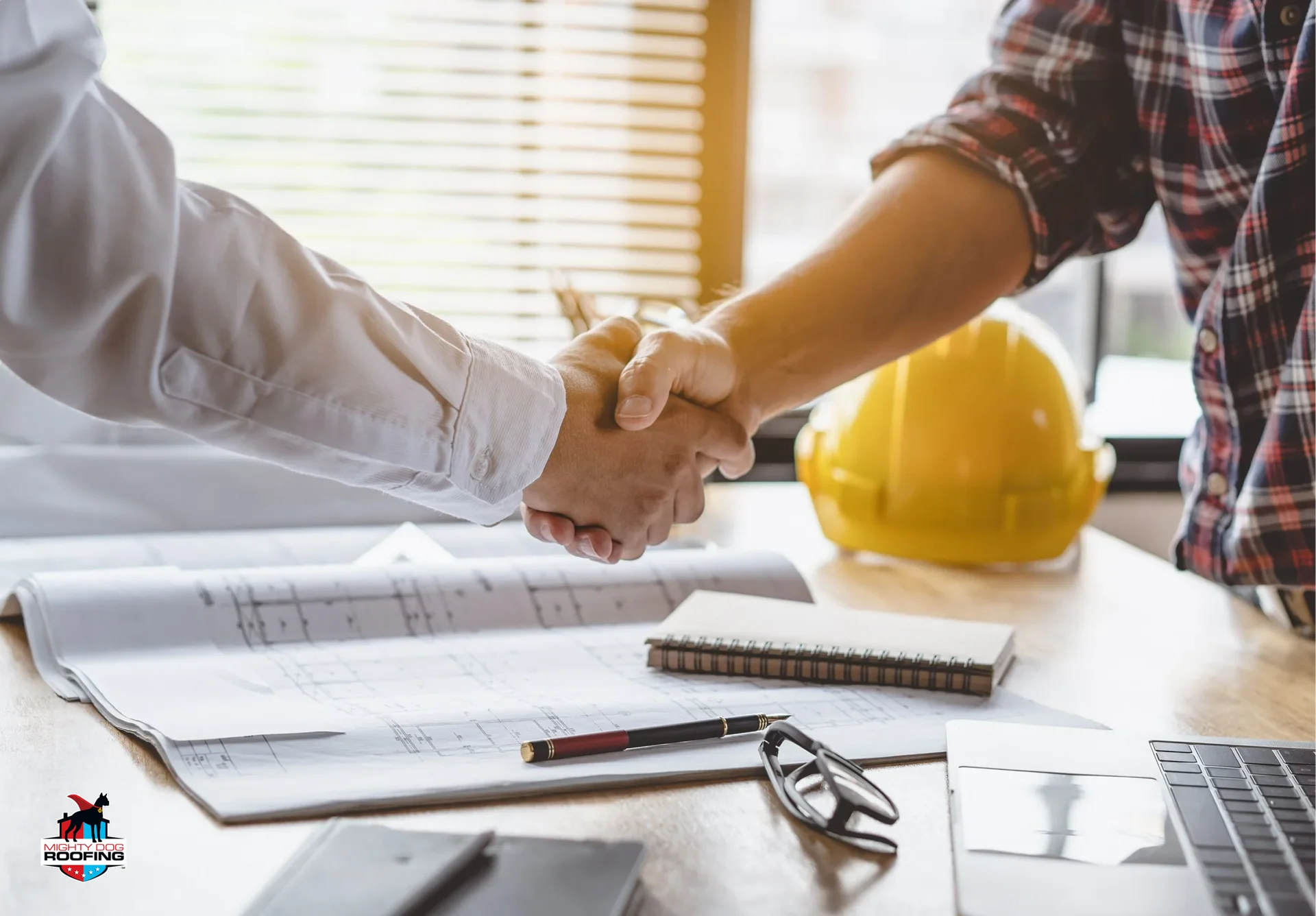 siding contractor seals agreement with homeowner